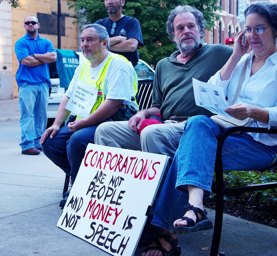 A protest sign about money in politics